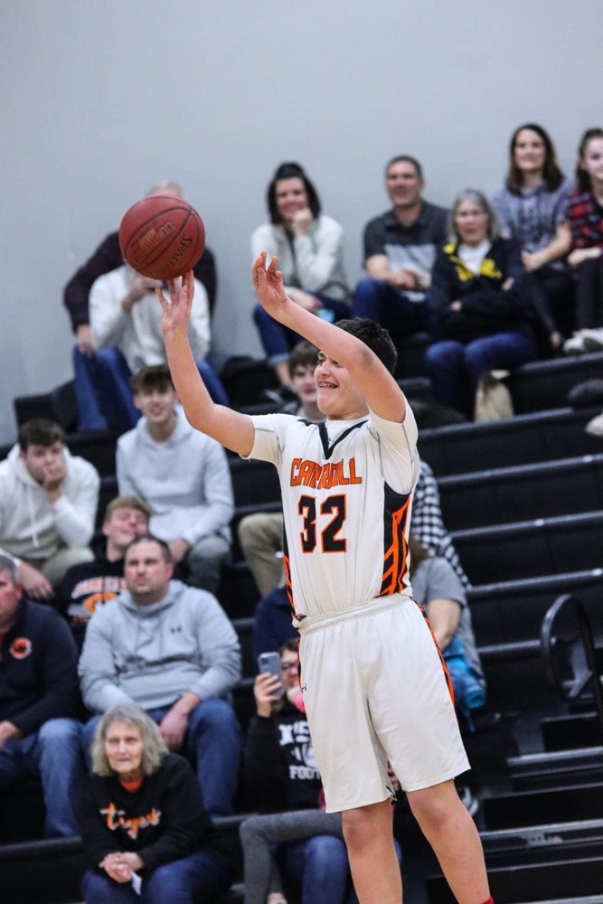 tyson lundstrom shooting a basketball