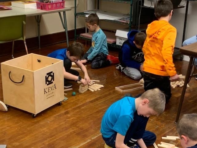 students building with keva planks
